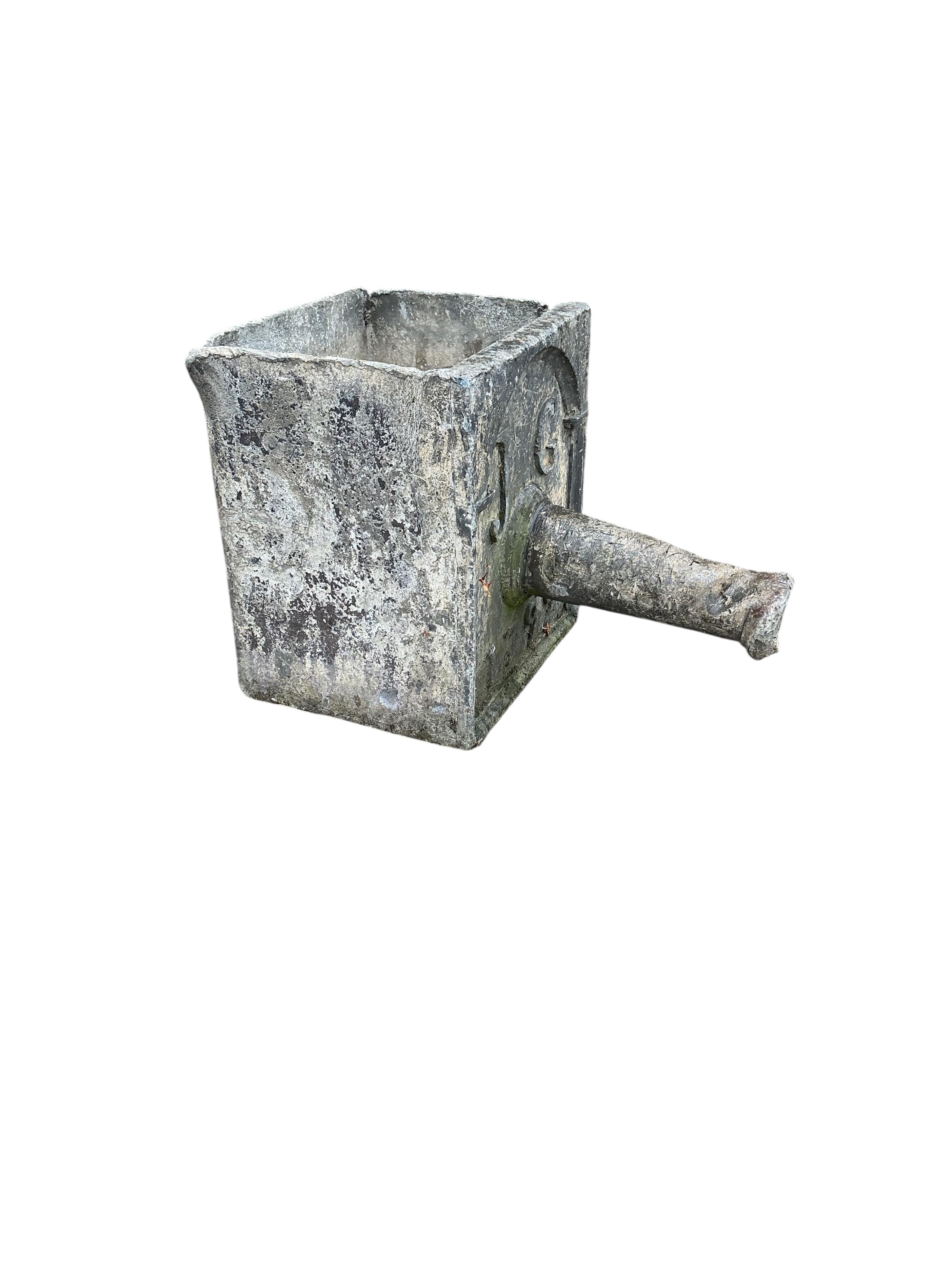 A George III lead hopper dated 1799 and initialled J.G., width 26cm, depth 40cm, height 30cm